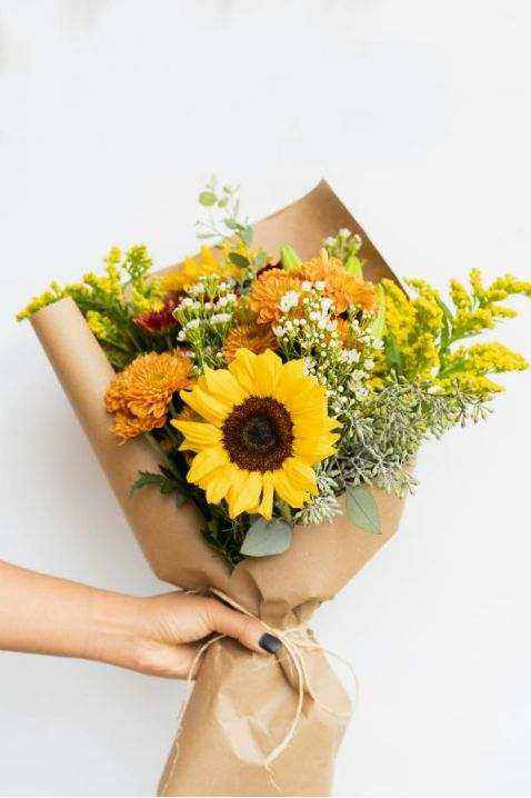 Instructor arranging seasonal flowers